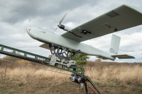 A fixed-wing ISR drone on a catapult launcher.