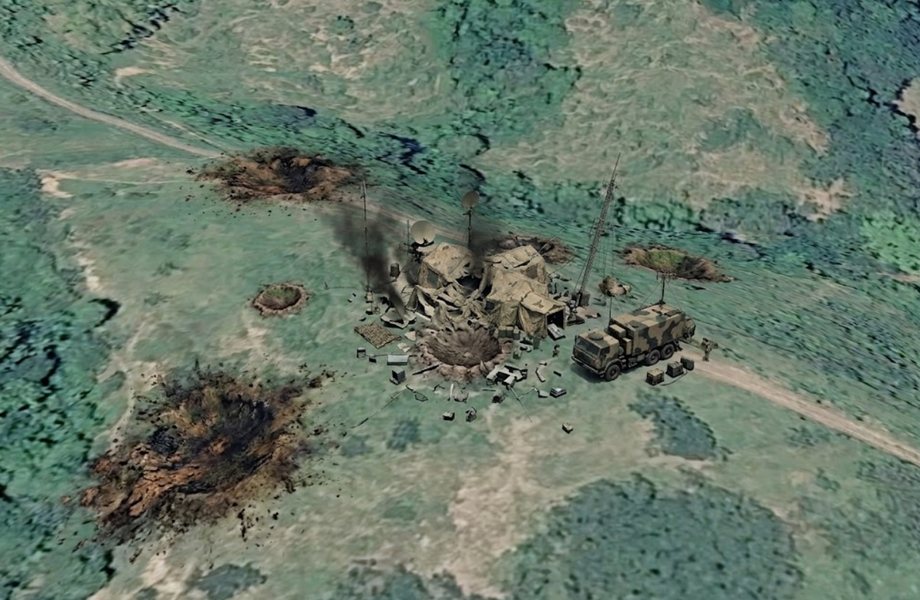 The same command post after the first attack. The centre tent has collapsed into a crater, one satellite dish is down and debris is scattered across the site. Three further craters have burned the ground short of the target. The command vehicle is still upright on the track and appears undamaged.
