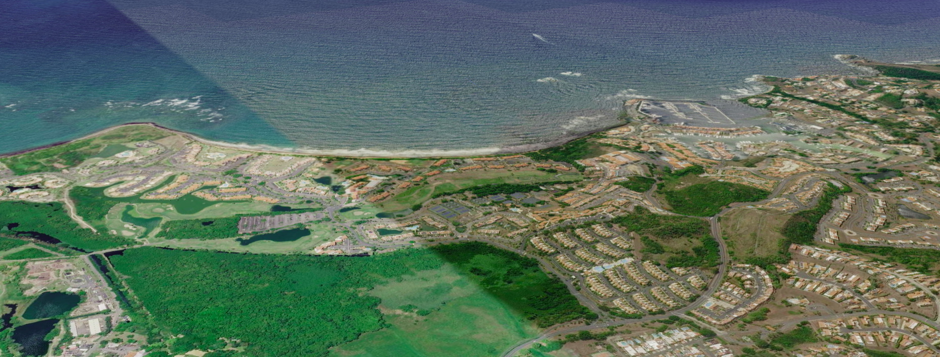 Oblique aerial view of the coastline from the drone's point of view.